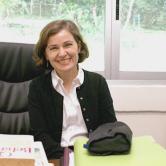 Milena van der Laat sitting in her FSU Panama office