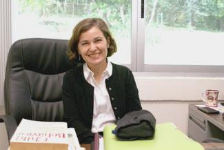 Milena van der Laat sitting in her FSU Panama office